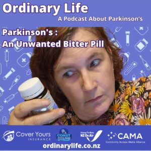 image shows kitty Doyle looking sideways at a brown pill bottle.
