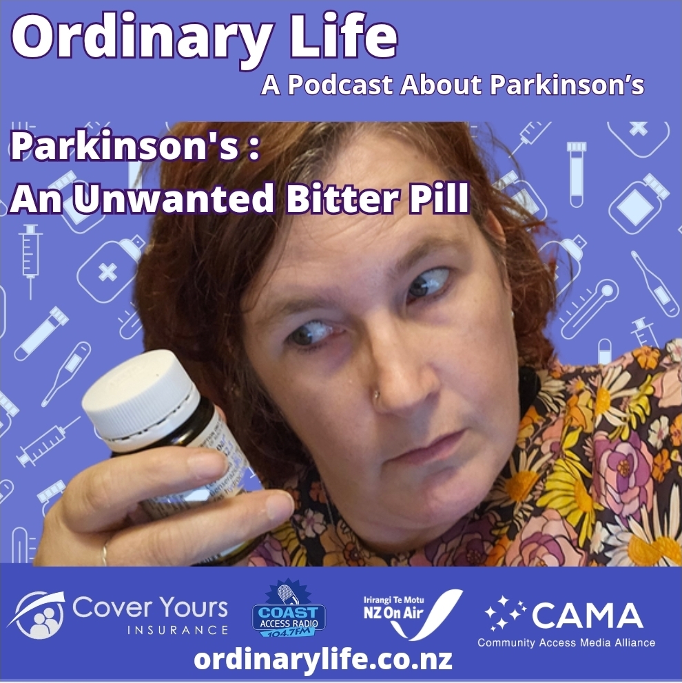 image shows kitty Doyle looking sideways at a brown pill bottle.
